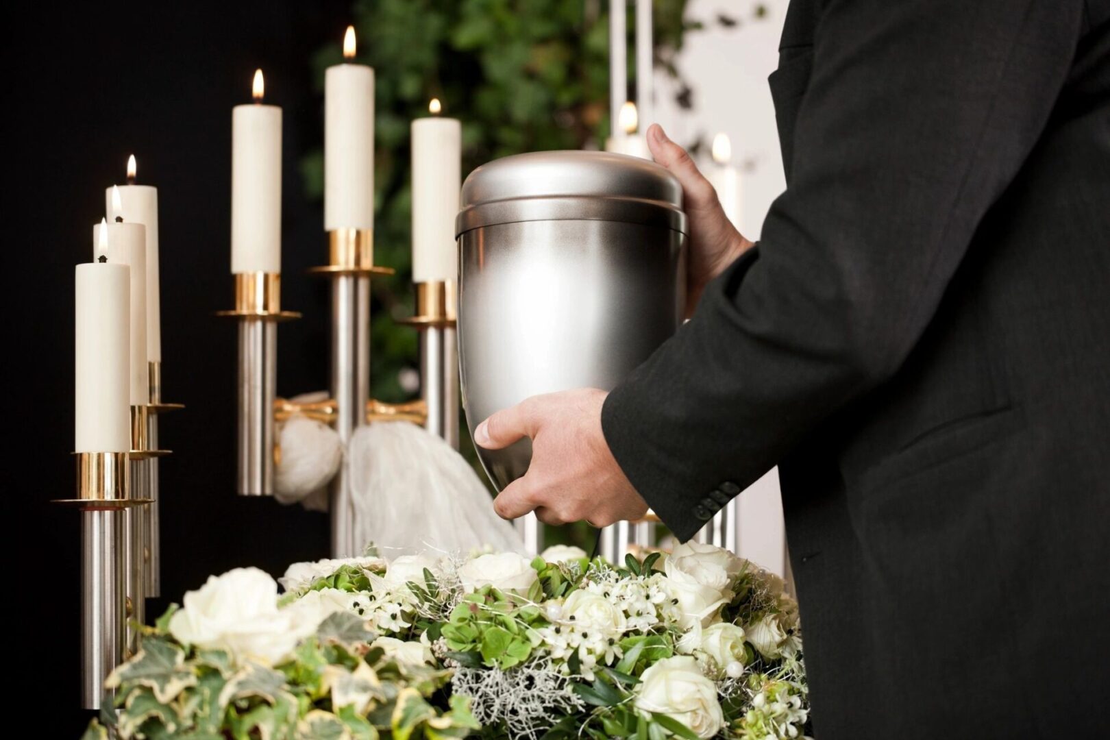 Cremation service man holding urn